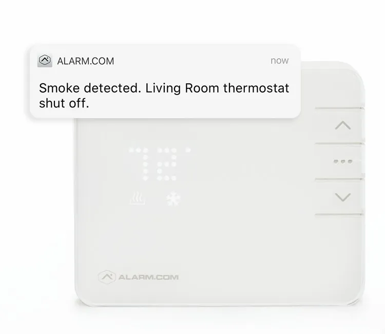 Smart thermostat showing a smoke detected alert